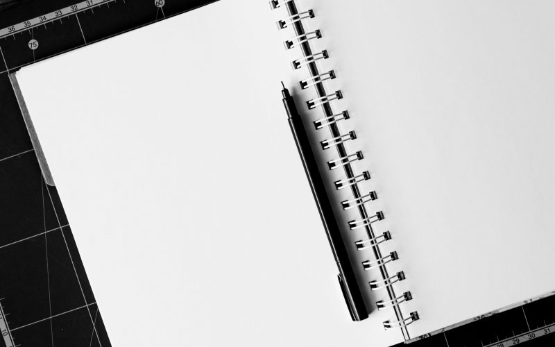black-ball-point-pen-on-white-notebook-158771